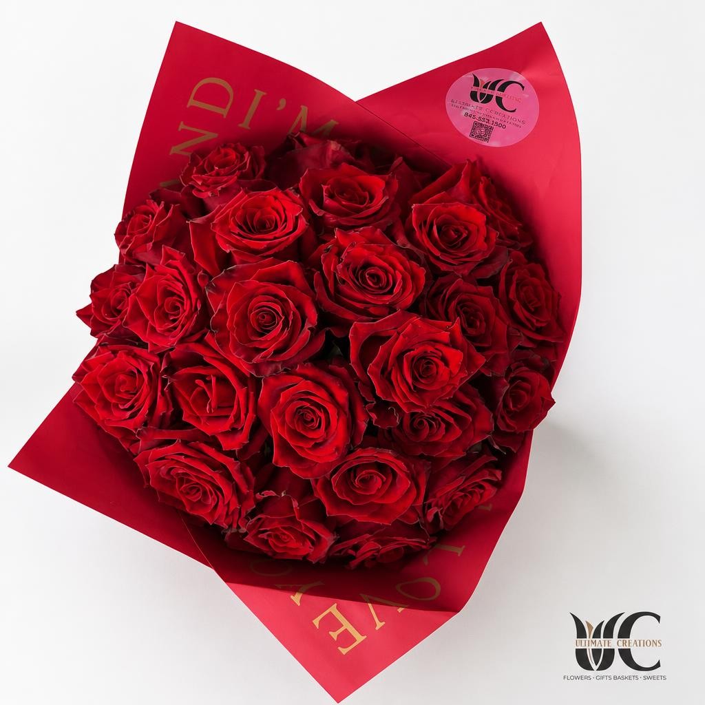 Abundant bouquet of red roses in vivid red decorative wrap
