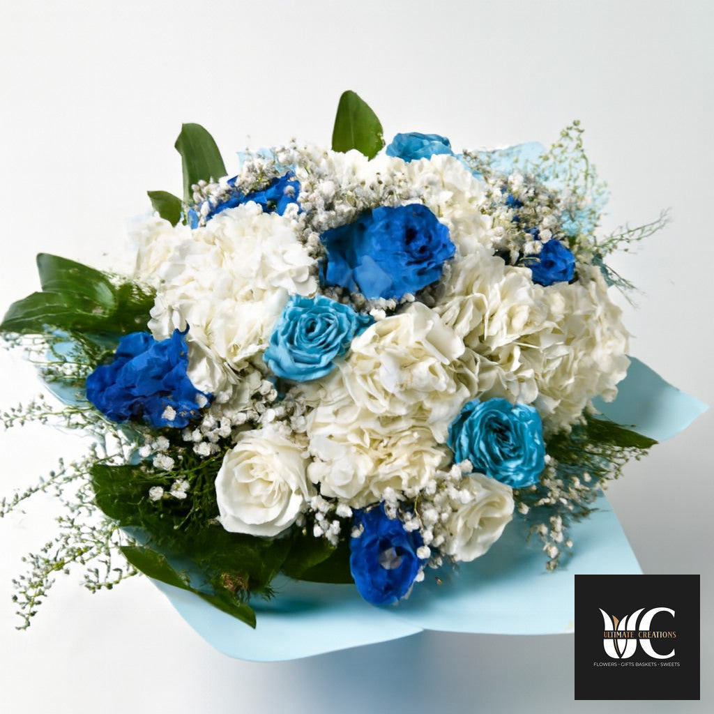 Hand-tied bouquet of white and blue flowers with greenery on a light blue wrap.