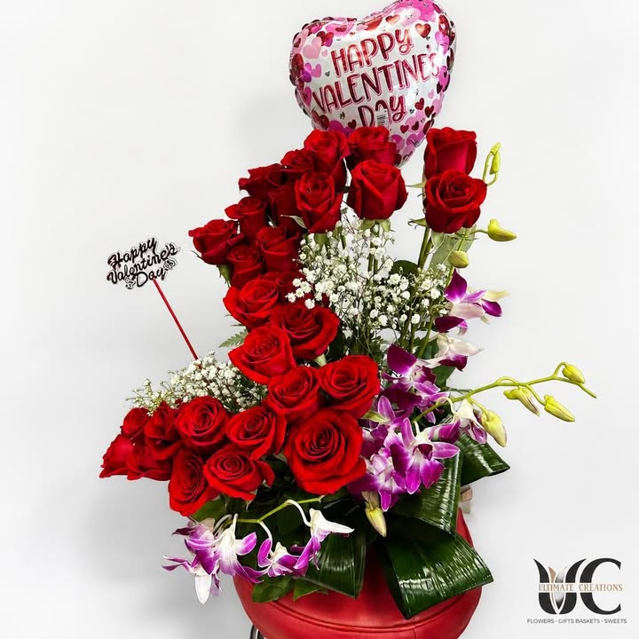 Red rose and purple orchid arrangement with a Valentine’s Day balloon