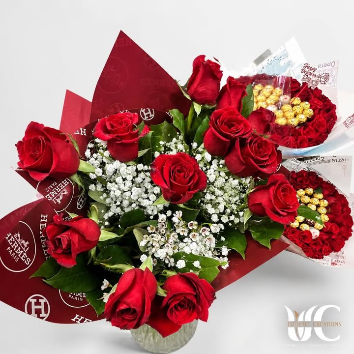 Red rose bouquet with green leaves, decorative butterflies, and black patterned wrapping