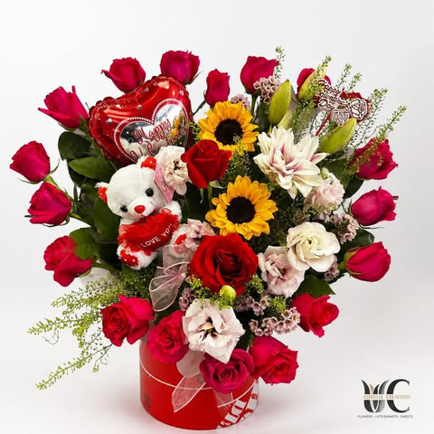 Red rose and sunflower gift box with teddy bear and heart balloon