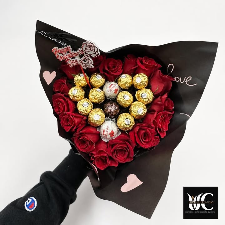 Red rose bouquet with gold chocolates and Valentine’s Day accents