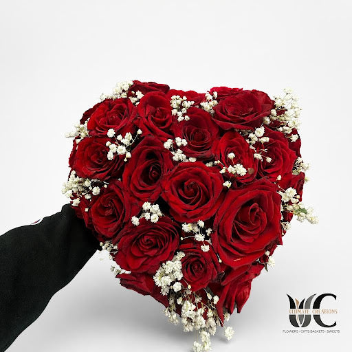 Full red rose bouquet accented with white filler flowers.