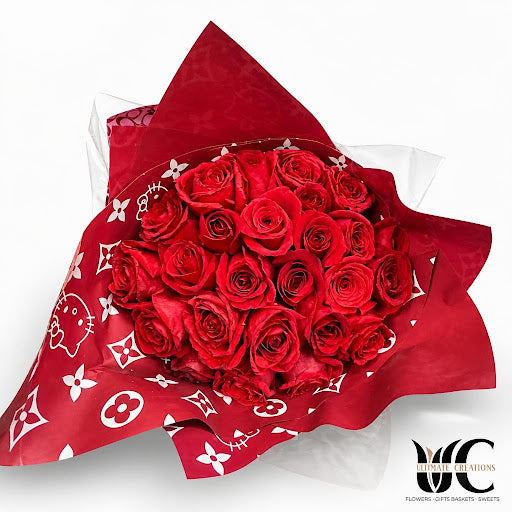 Full red rose bouquet in patterned red wrapping.
