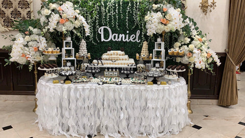 Daniel Bar Mitzvah custom sweet table, white orchid florals and greenery backdrop at Kol Israel Shul in Jamaica Estates