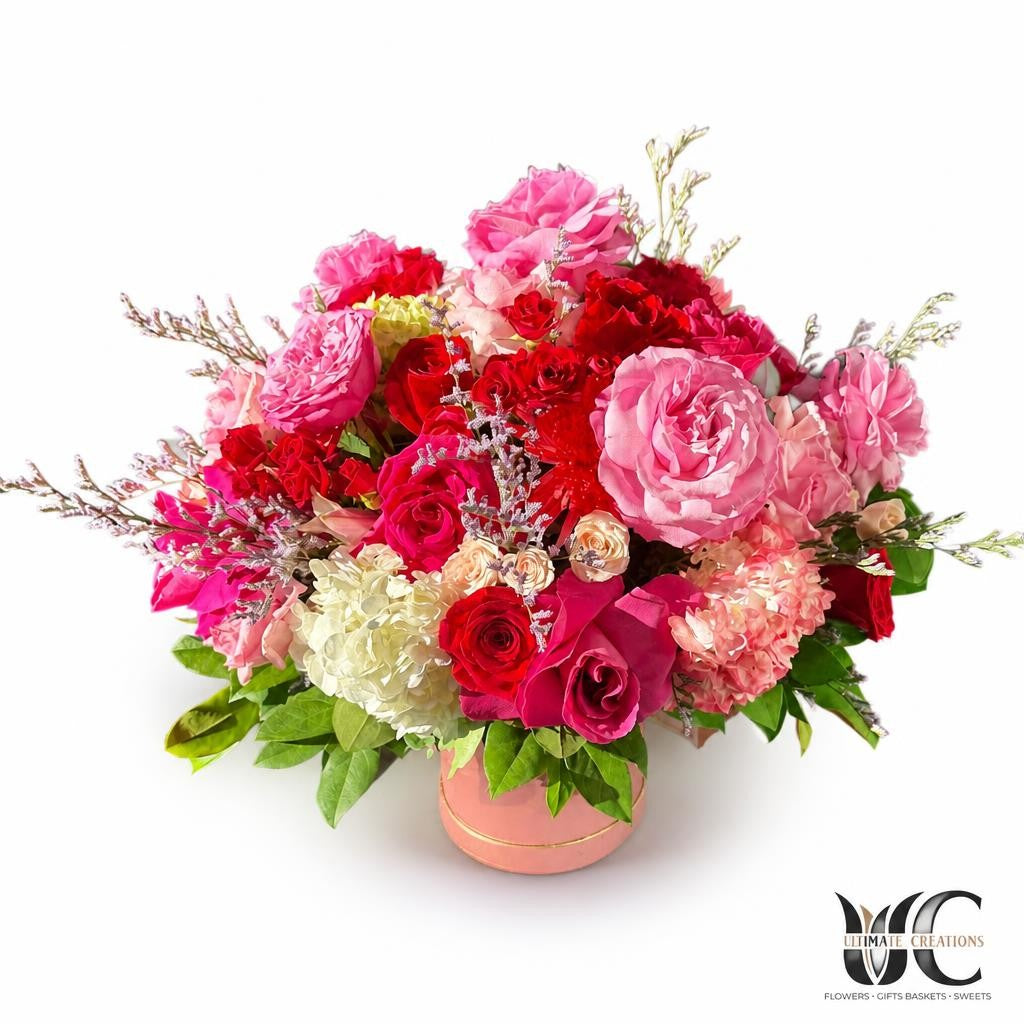 Romantic pink and red flower box arrangement