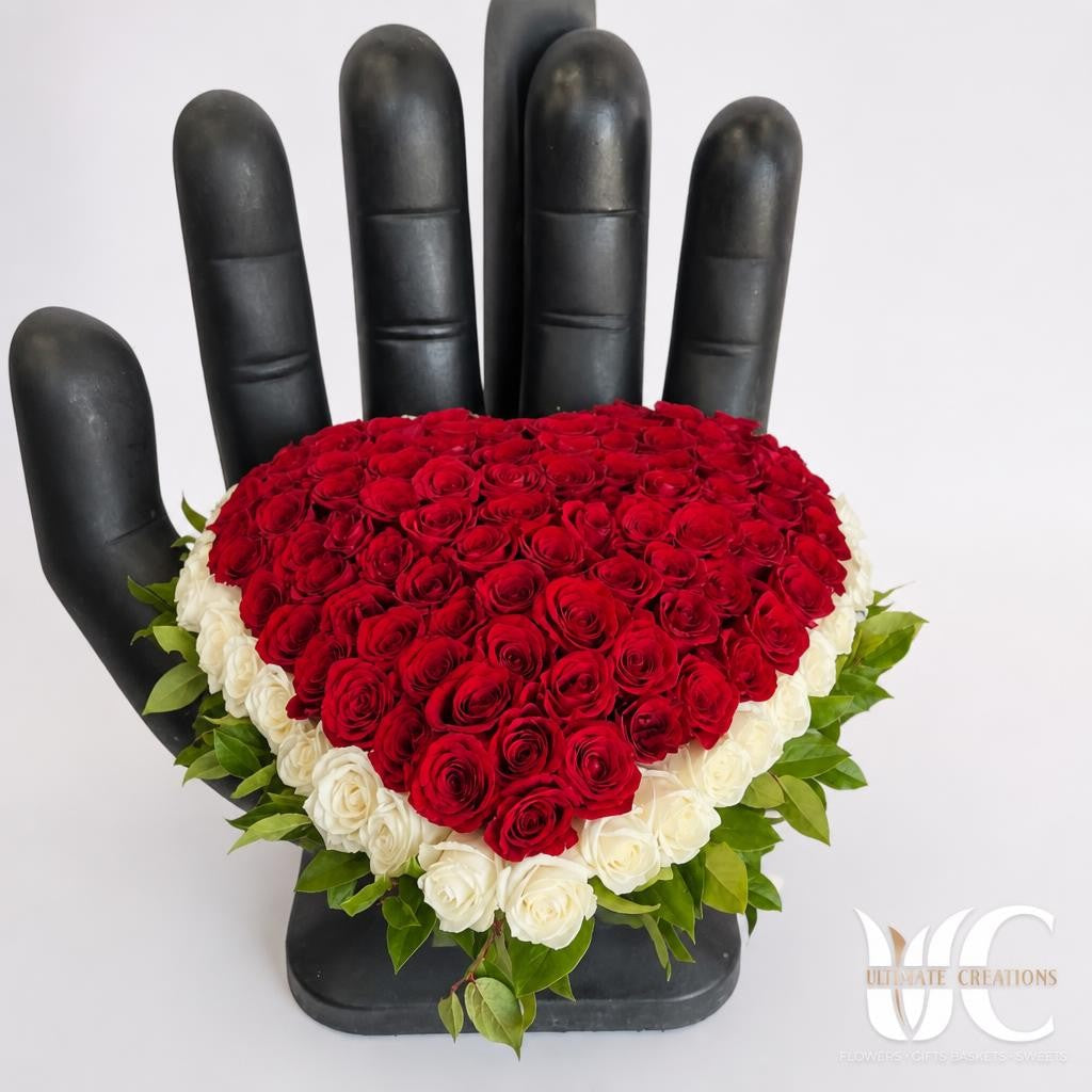 Heart shaped red and ivory rose arrangement