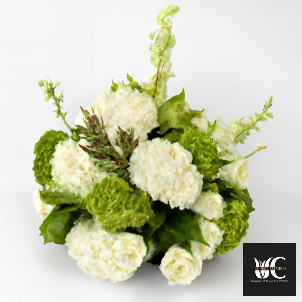 Green and white floral vase arrangement with rounded blooms and airy stems on a white background.