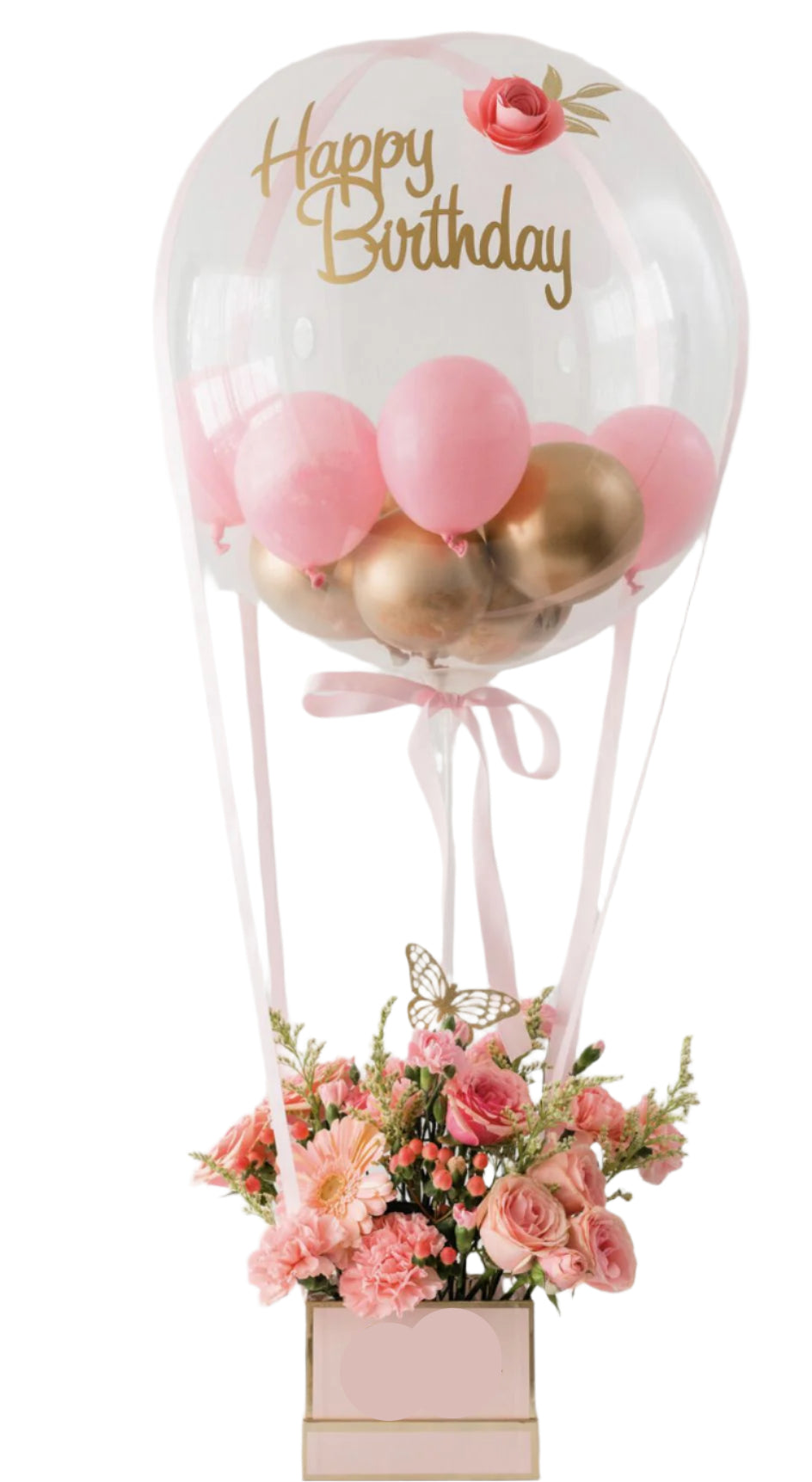 Decorative birthday arrangement with balloons and flowers in a clear balloon.