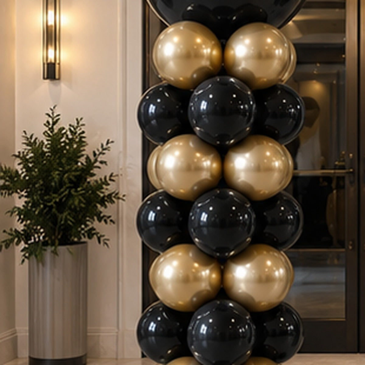 Classic premium black and gold balloon column for an upscale event entrance