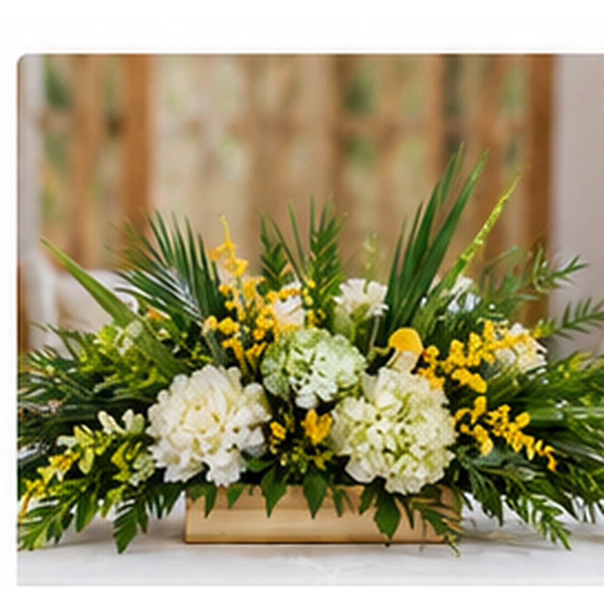 Deluxe Sukkot table centerpiece with premium white flowers, greenery and seasonal yellow accents