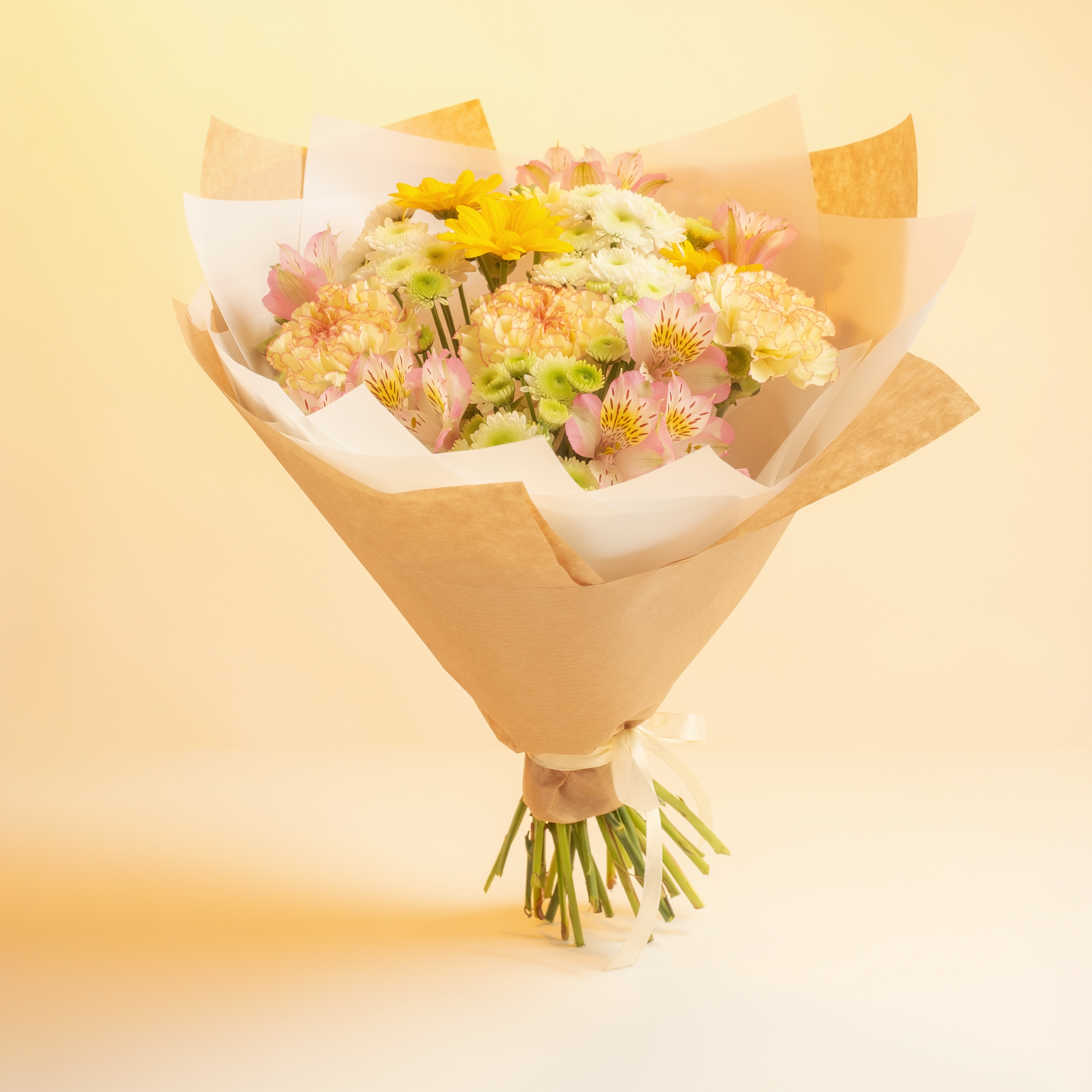Angled view of a $25 florist's choice hand-tied seasonal bouquet