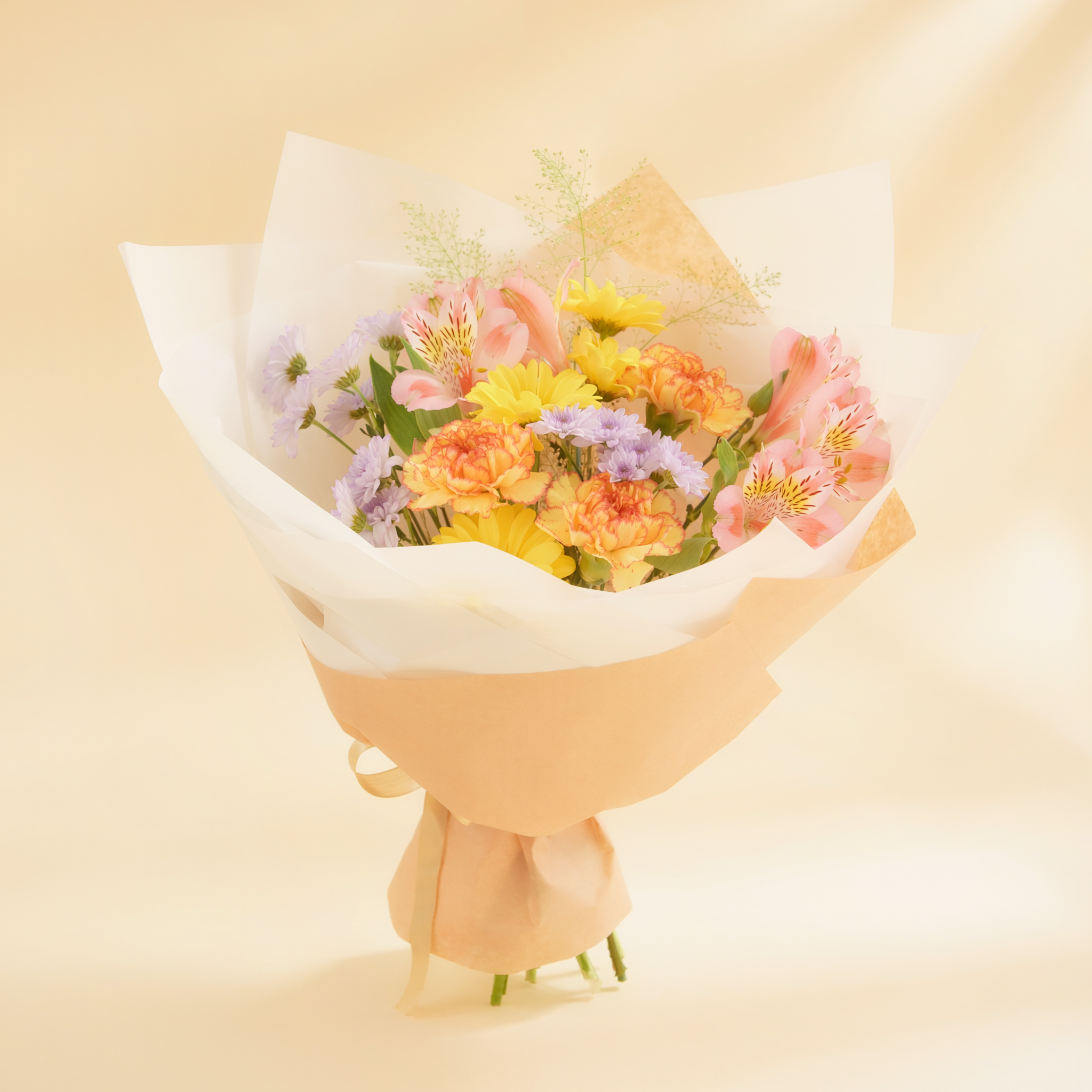 Bright seasonal color example of a $25 florist's choice hand-tied bouquet
