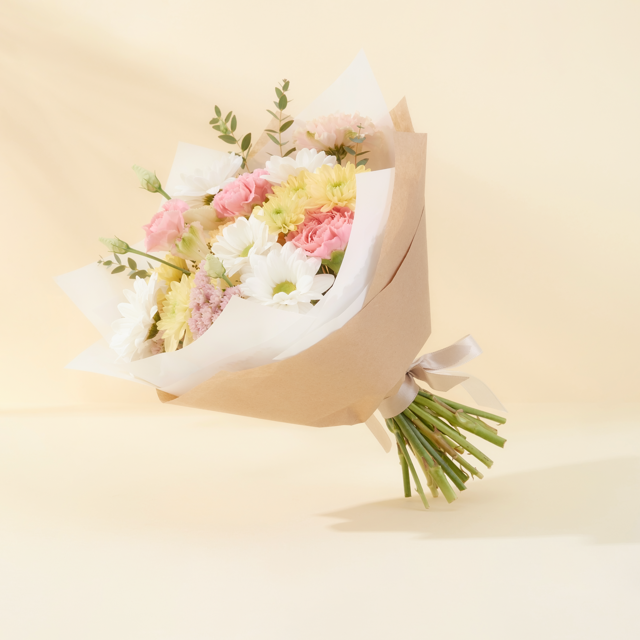 Side view showing the stems and kraft wrapping of a $25 hand-tied bouquet