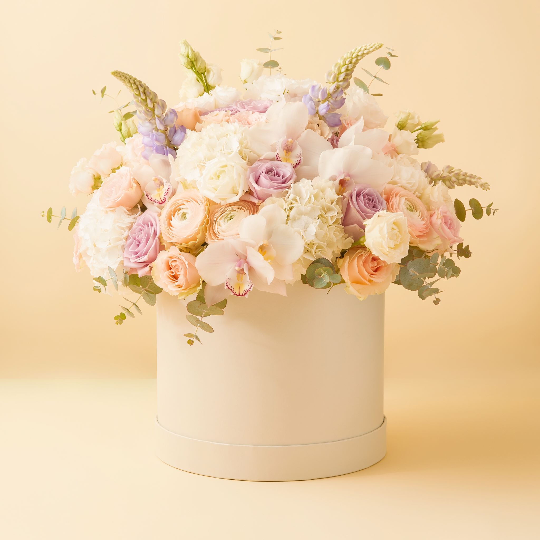 Luxury florist's choice mixed flower arrangement in an elegant round box