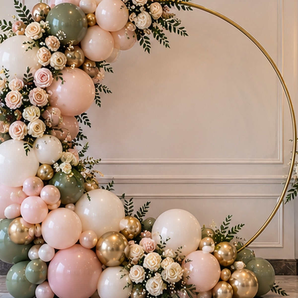 Close view of premium organic balloons and floral accents on a gold circle hoop backdrop