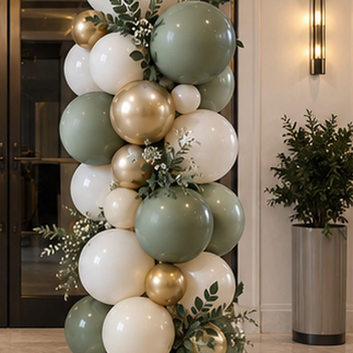 Luxury organic balloon column in cream sage and gold with mixed balloon sizes