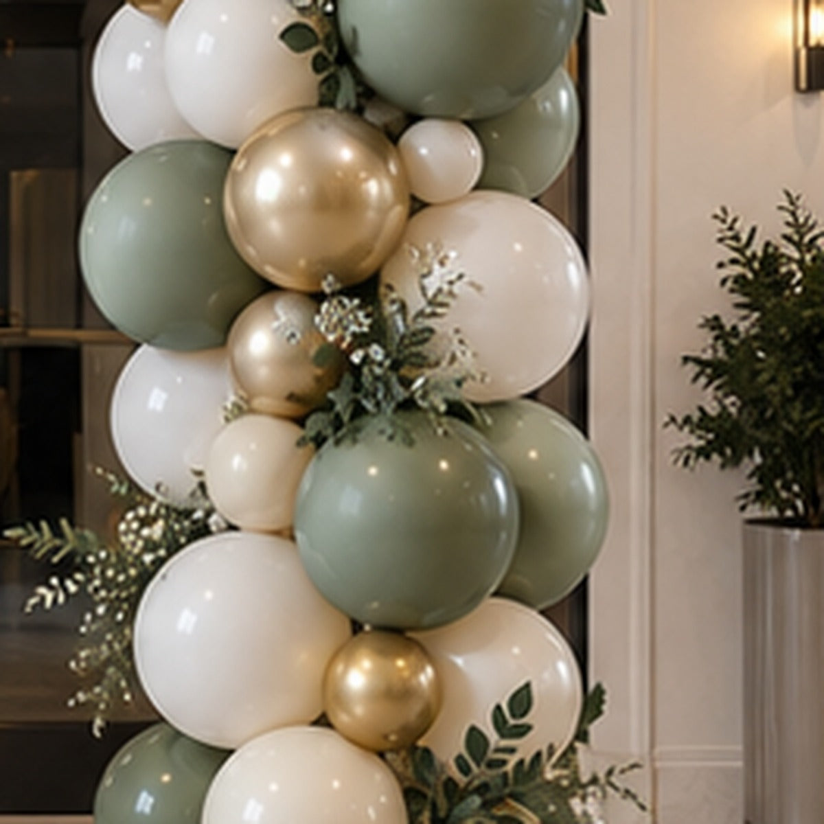 Close detail of premium organic balloon column with mixed sizes metallic accents and greenery