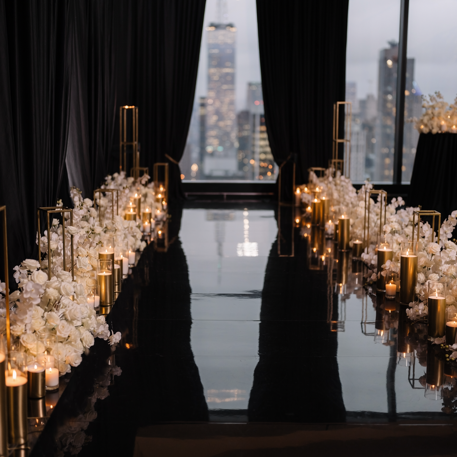 Black Label private Manhattan penthouse proposal aisle with white florals, black draping and candlelight