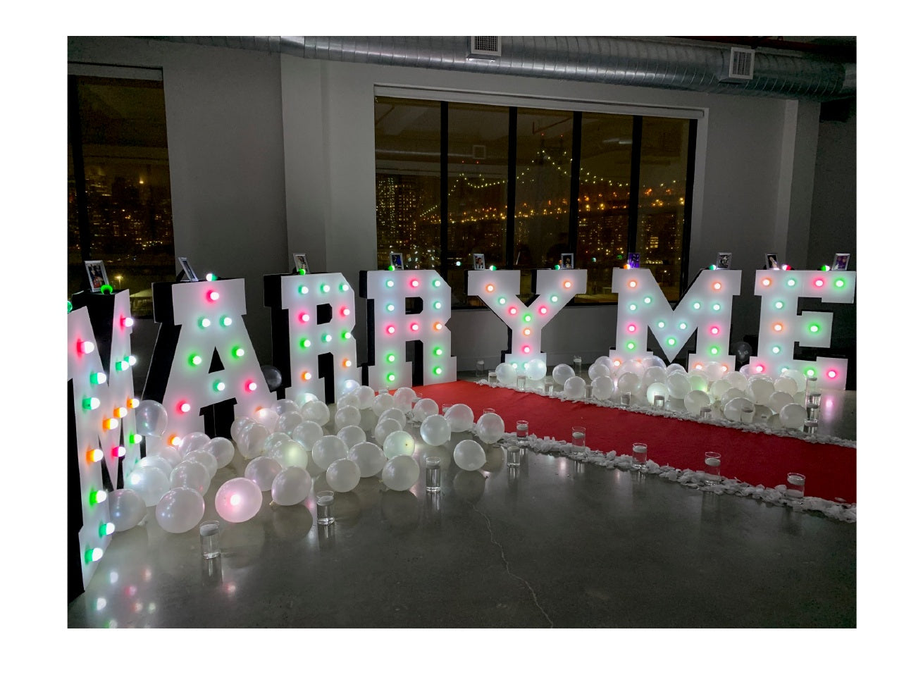 Basic NYC marriage proposal package with illuminated MARRY ME letters and balloons