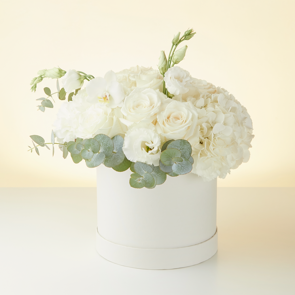 White and green luxury flower arrangement in an elegant box
